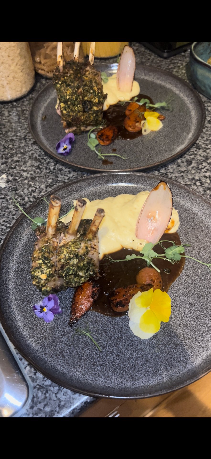 Chef plating a KezzyKooks dish